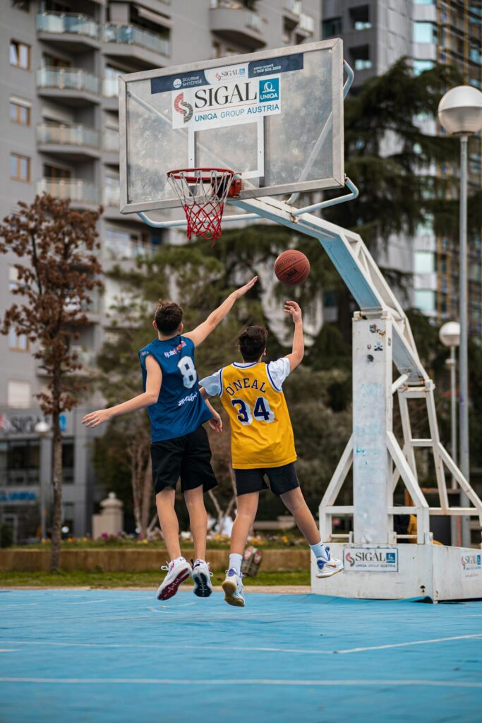 Teenager playing basketball to increase height naturally