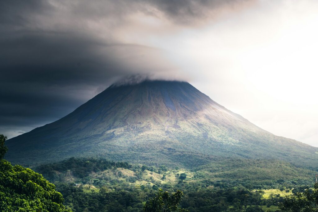 Retirees enjoying coffee with a view of Arenal volcano in Costa Rica

